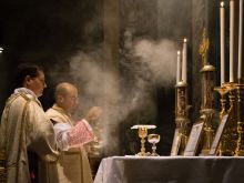 A priest celebrates the traditional Latin Mass at the Basilica of St. Pancras in Rome.